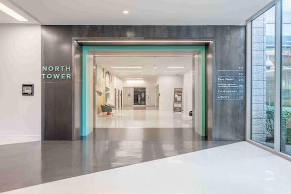 A hallway with a sign that says North Tower.