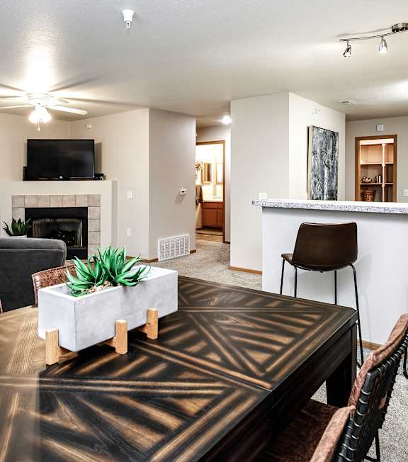 Living Room With Kitchen View at Tranquility Pointe, Omaha, NE