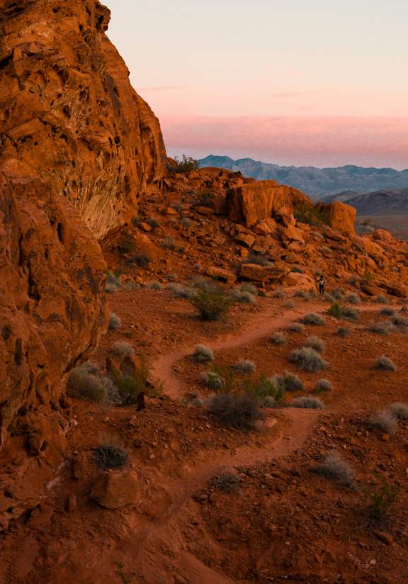 A rocky landscape with a dirt path leading through it.