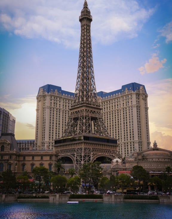 a view of the eiffel tower in front of the parisienne hotel