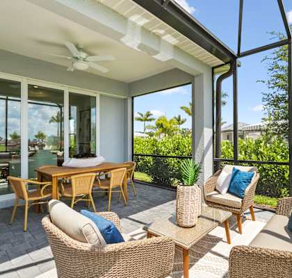 A patio with a table and chairs is shown