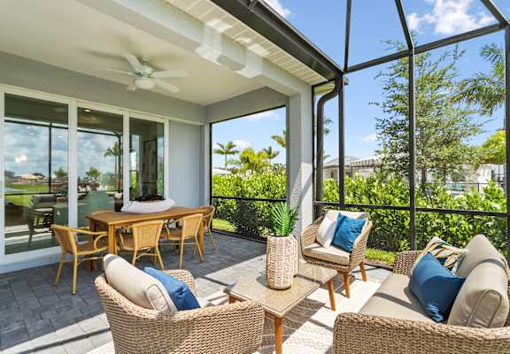 A patio with a table and chairs is shown.