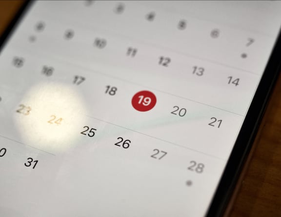 a close up of a cell phone calendar with the number 19 on it