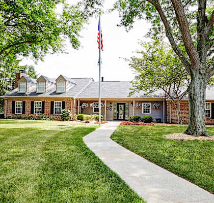 a house with an american flag in front of it