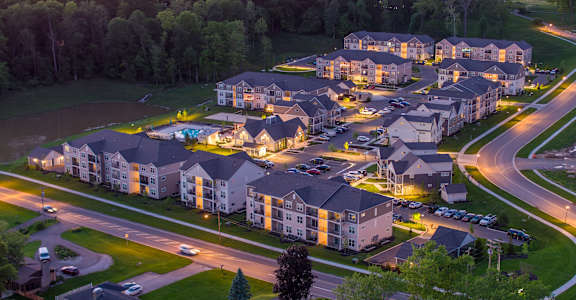 an aerial view of the apartments at dusk at The Bend, Lancaster, OH
