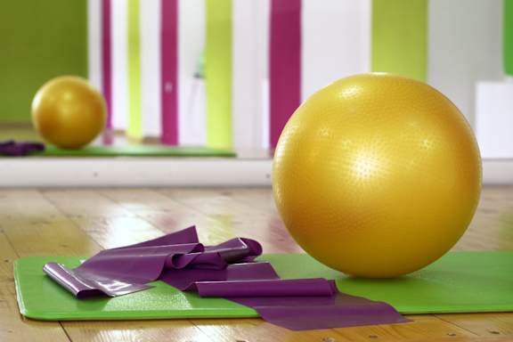 Yoga mat and ball in gym