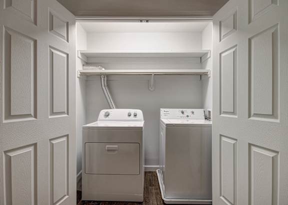 A laundry room with a washer and dryer.