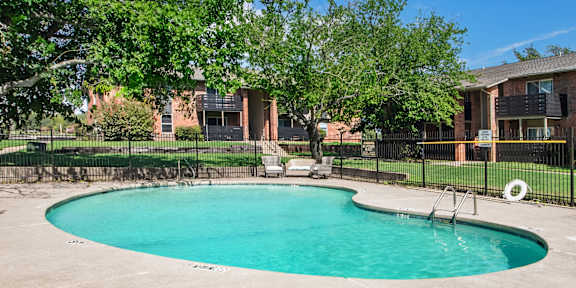 our apartments have a large pool and lounge chairs