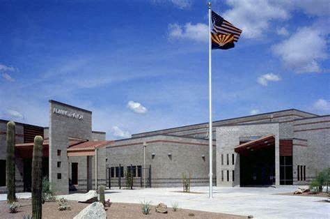 an flag flies in front of a building