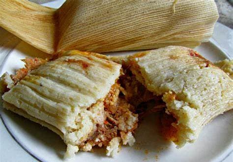 a sandwich on a plate with a book