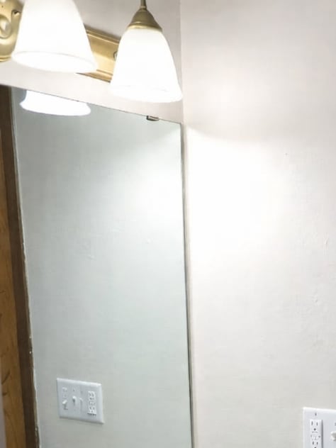 A bathroom with a sink, toilet, and shower.