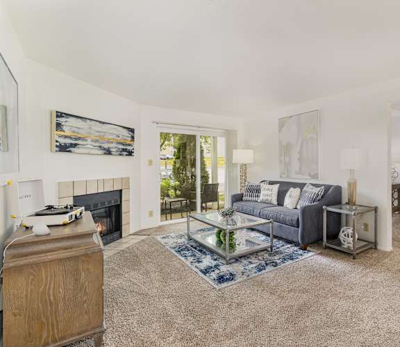 A living room with a fireplace and a couch.