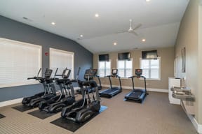 the gym has plenty of cardio equipment and windows at Stoney Pointe Apartment Homes, Wichita, 67226