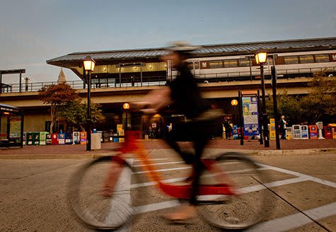 a person riding a bike down a street