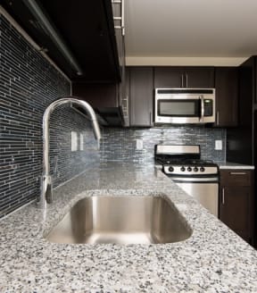 a kitchen with a sink and a stove