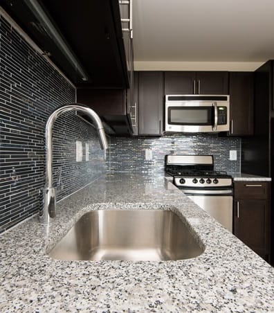 a kitchen with a sink and a stove