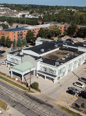 an aerial view of a building with a green roof
