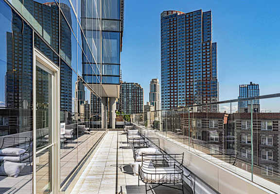 Exterior view of 3THIRTY3 Apartments, a contemporary complex with modern architecture and spacious balconies.