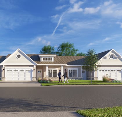 A two-story house with a garage and a driveway.