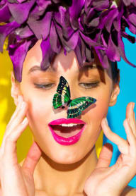 a woman with a butterfly on her face