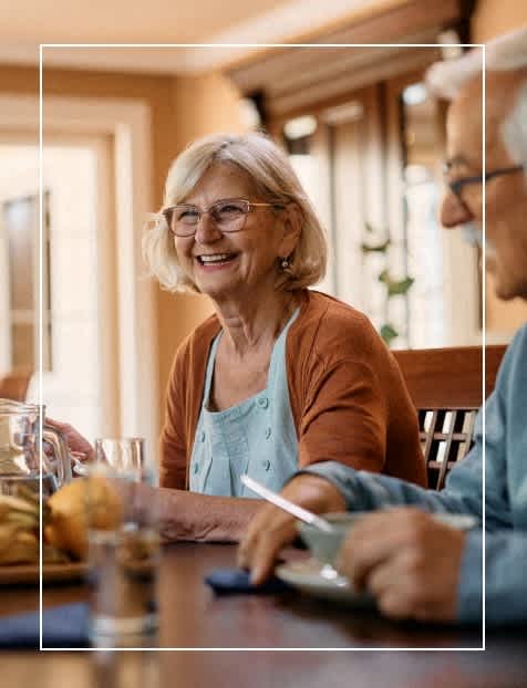 three photos of an older couple sitting at a table at Siena Luxury Residences Apartments, Cinnaminson, 08077