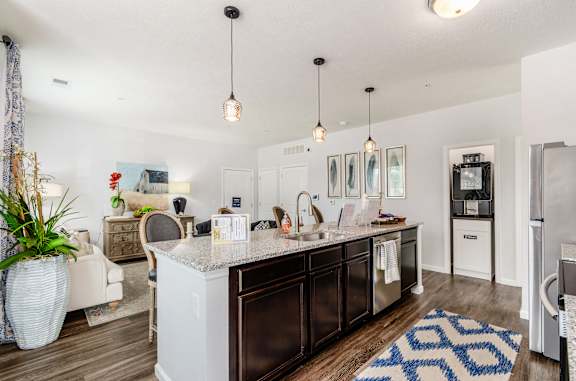 a kitchen and dining room with a table and chairs