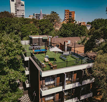 an aerial view of a building with a green roof