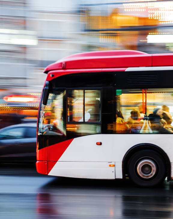 a bus driving down a street