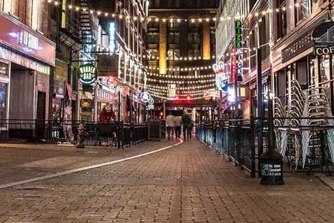 a city street at night with street lights at East 4th Street, Cleveland, OH