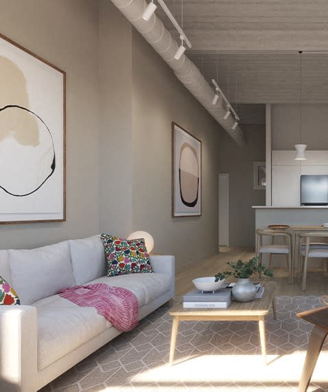 a living room with a white couch and a coffee table at East 4th Street, Cleveland, 44115