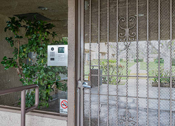 A gate with a sign on it that says "No Entry".
