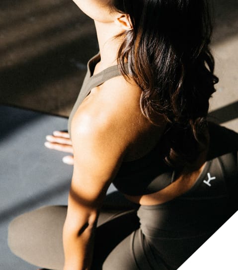 Woman Stretching on Yoga Mat at Corner 63, Washington