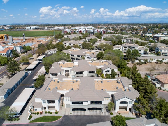 an aerial view of a neighborhood with houses and trees