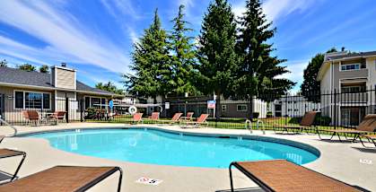 Maple Pointe outdoor seasonal swimming pool and lounge chairs