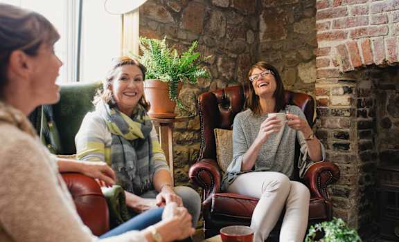 a group of women sitting in a living room at Bella Vista on Park, Florida