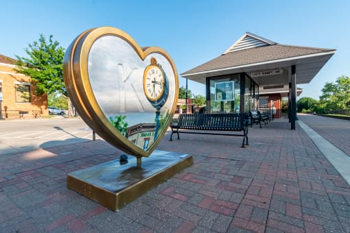 a large clock in the shape of a heart
