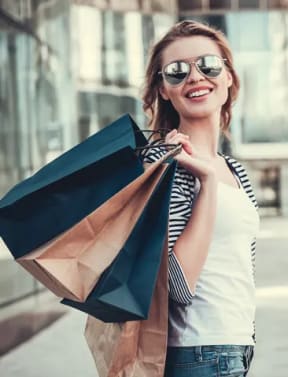 two women looking at clothes in a store