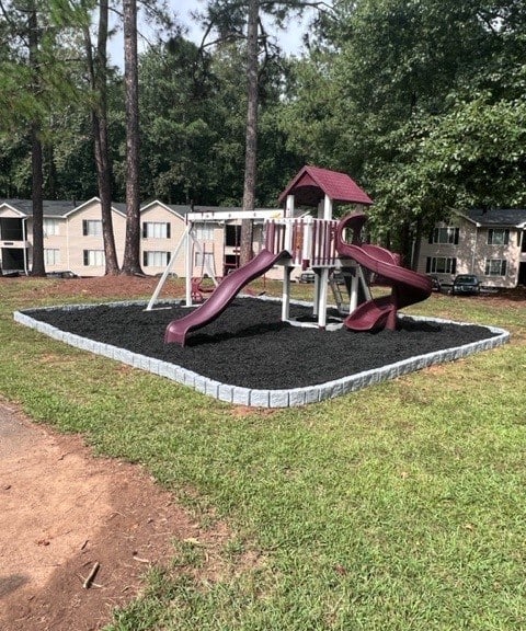 a playground with a slide and a swing set at Hidden Woods, Decatur, 30035