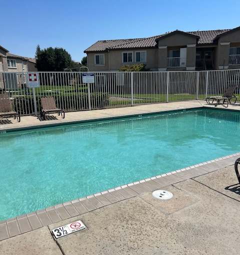 A pool with a sign that says 3% on the ground.