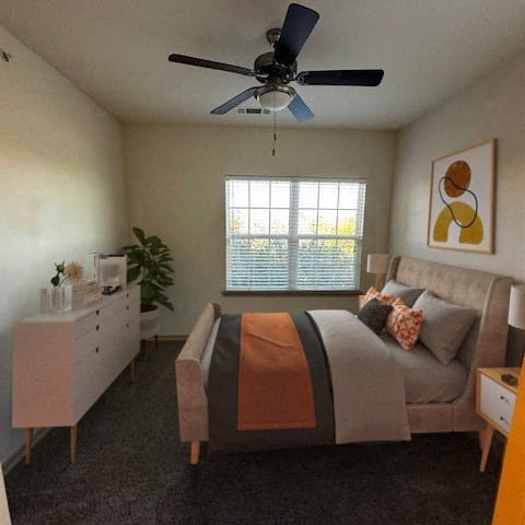 a bedroom with a bed and a ceiling fan
