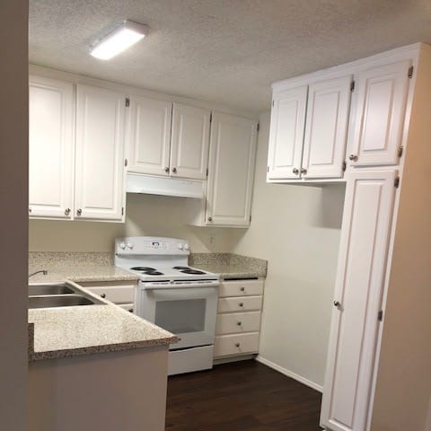 Las Casitas kitchen with white cabinets