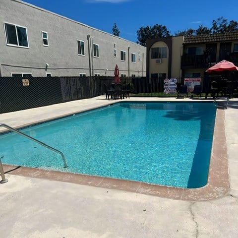 a swimming pool with a fence around it