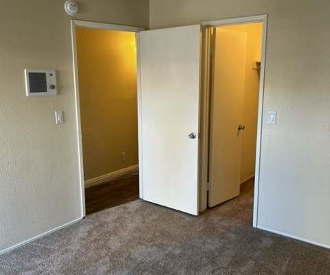an empty room with an open door