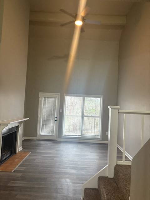 A room with a fireplace and a staircase.