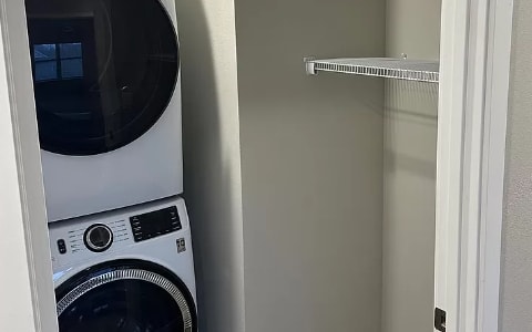 a small laundry room with a washing machine and a dryer