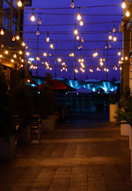 A patio with string lights at Calla Homes Apartments, Utah