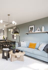 a bedroom with a bed and desk in a 555 waverly unit