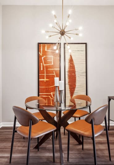 a dining room with a table and chairs at Metro 303, Hempstead, NY, 11550