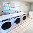 A laundromat with washers and dryers.