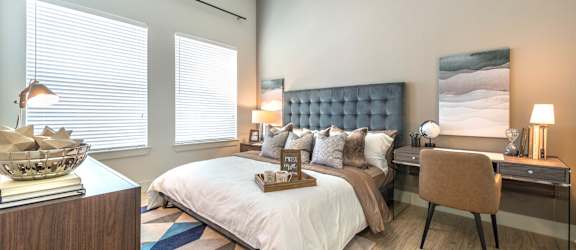 a blue wall with a clock on top of it
